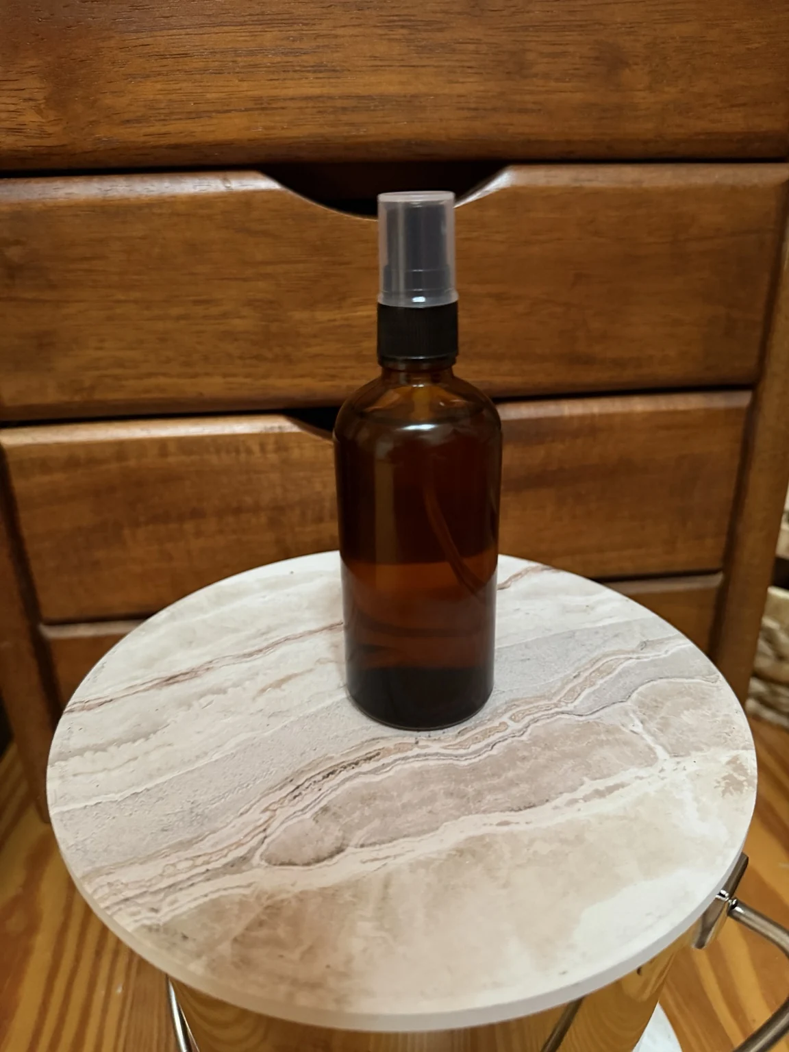 Representative amber spray bottle used for Temple Jow herbal liniment